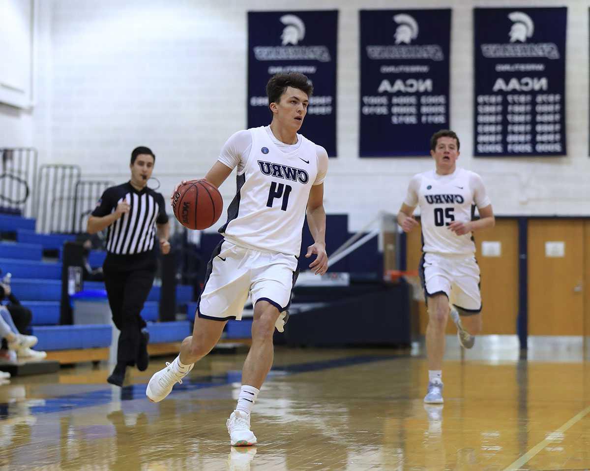 Photo of a Case Western Reserve University men’s basketball player dribbling during a game